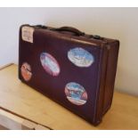 Small Vintage Travel Case Suitcase, with vintage Hotel Travel labels stage prop shop display