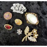 Group of vintage costume brooches and pandant, various materials agea.