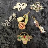 Group of vintage brooches, various materials.