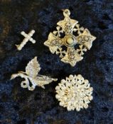 Group lot of white metal dress brooches and pendant.