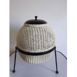 A Lloyd Loom 'Sputnik' linen basket