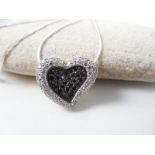 Heart shaped silver pendant on chain