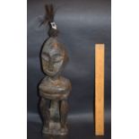 African Wood Carving Of Seated Man With Hair