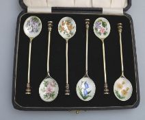 A good set of solid silver and gilt & floral enamel Coffee spoons with seal ends - cased C.1968