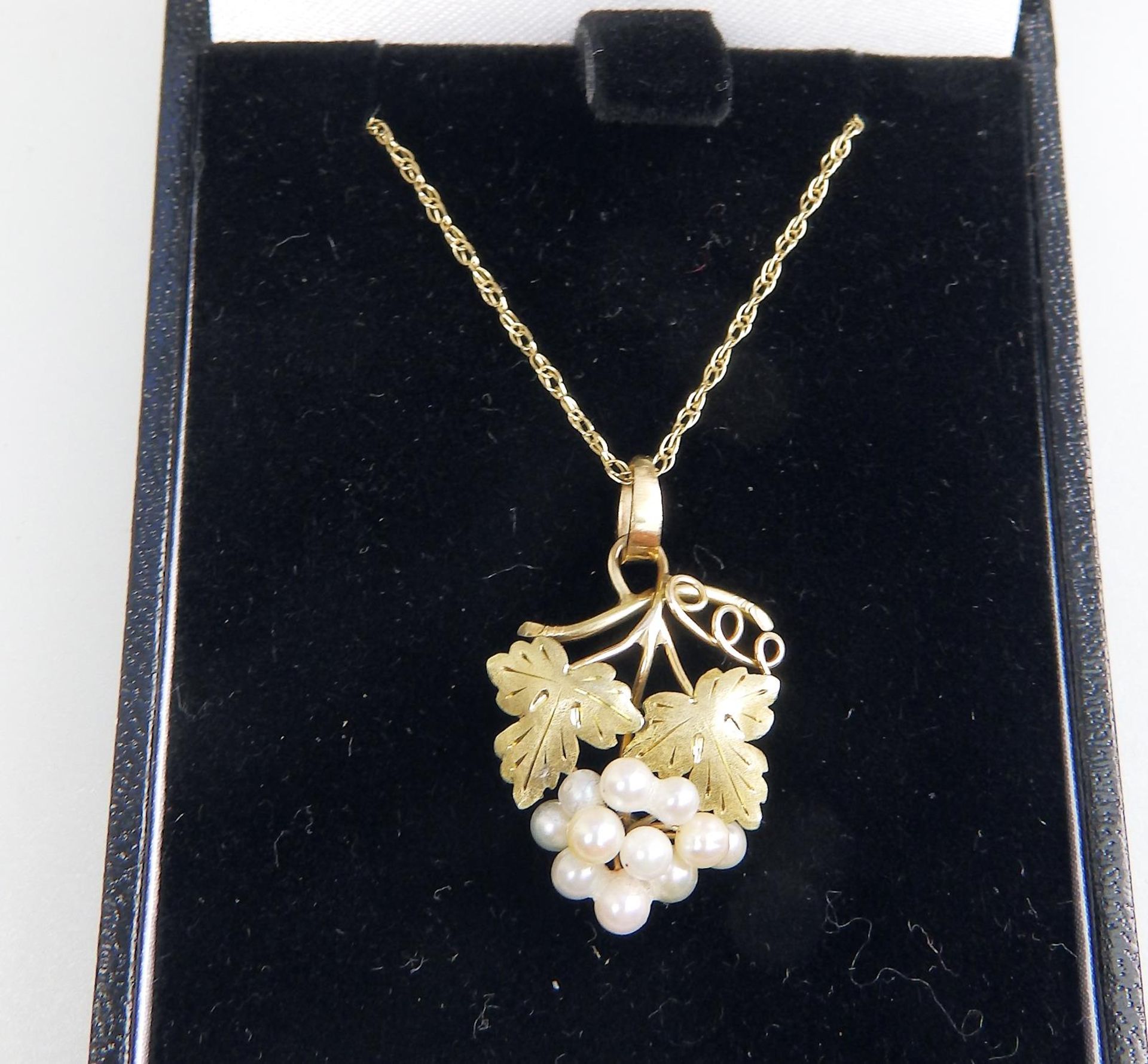 A 14 ct gold designer Pendant and chain, boxed