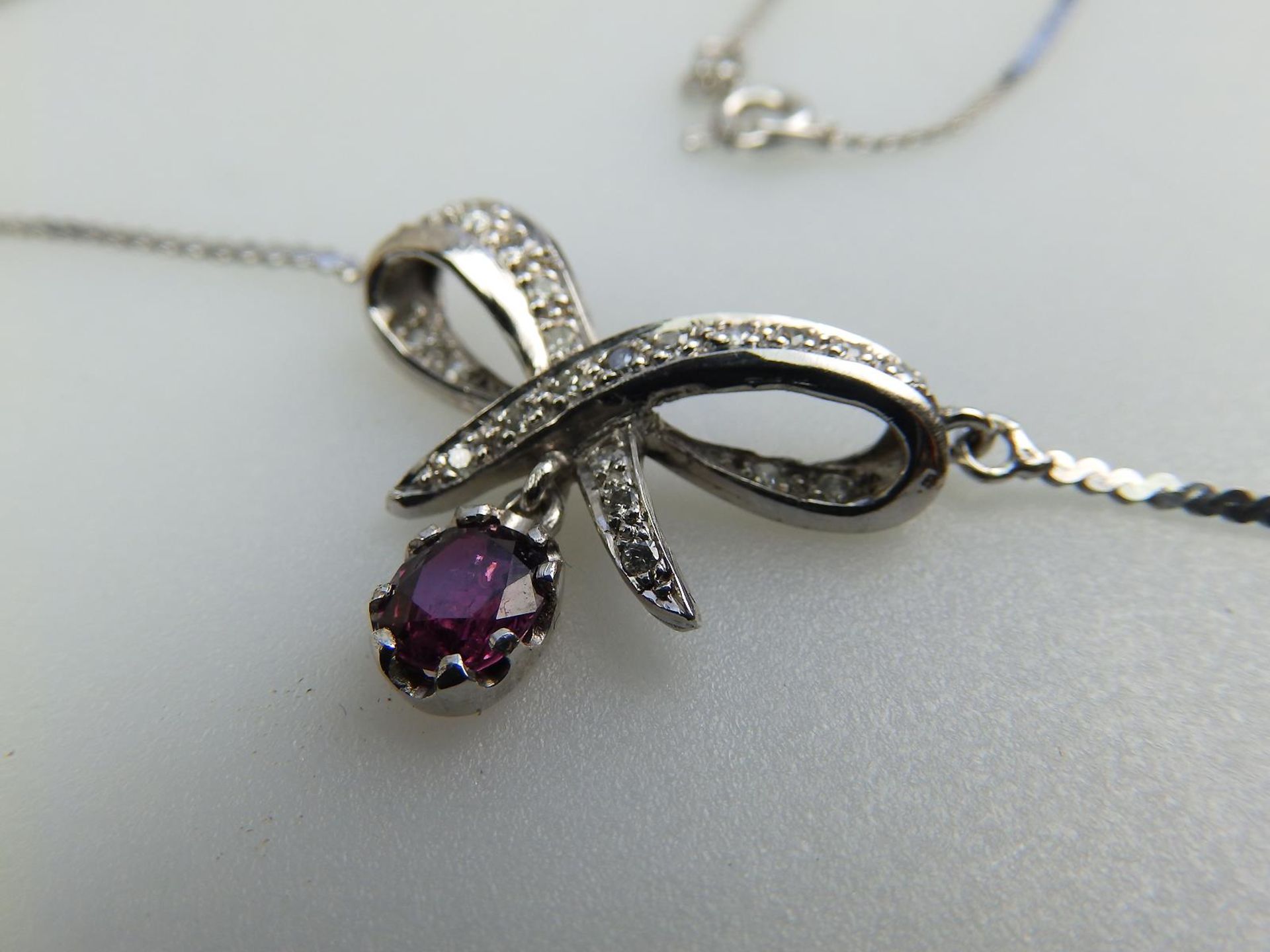 A 9 ct white gold and diamond & garnet pendant and chain, boxed - Image 2 of 4