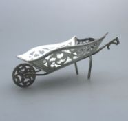 A miniature novelty solid silver Wheelbarrow pierced body, moving wheel C.1908
