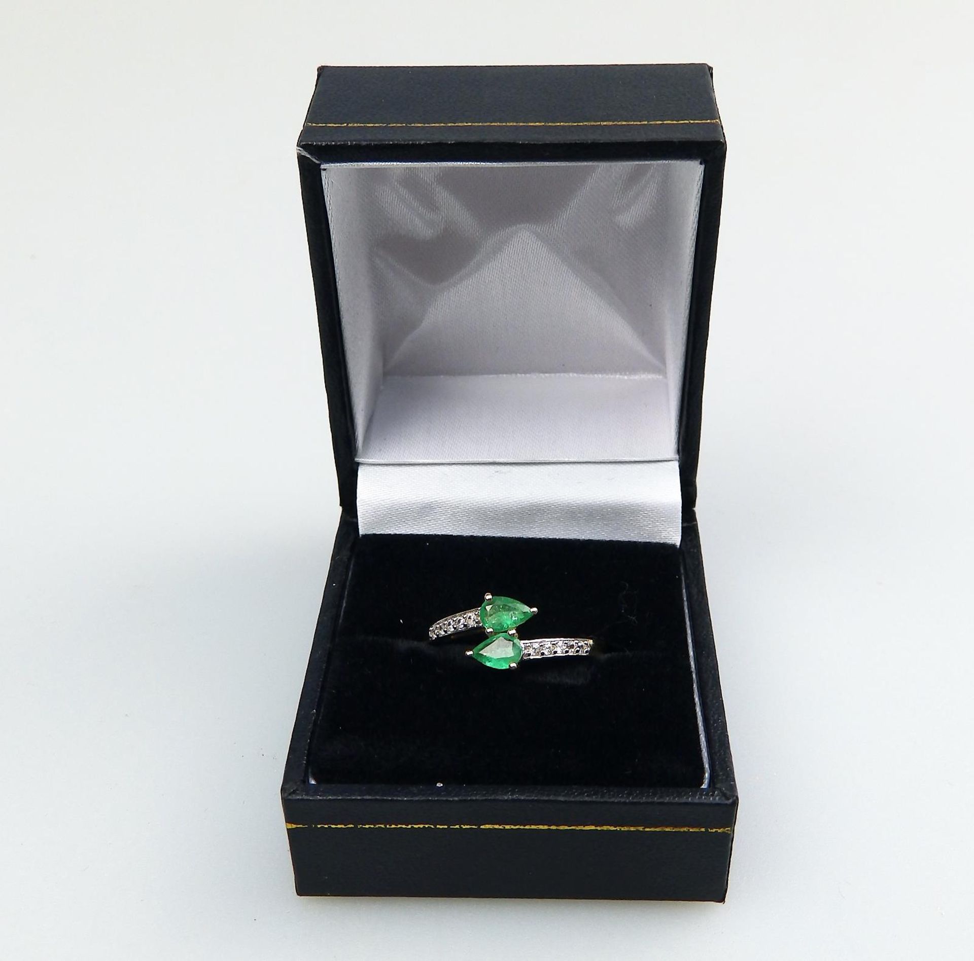 A 10ct gold, emerald and white topaz Crossover Ring, boxed - Image 2 of 5