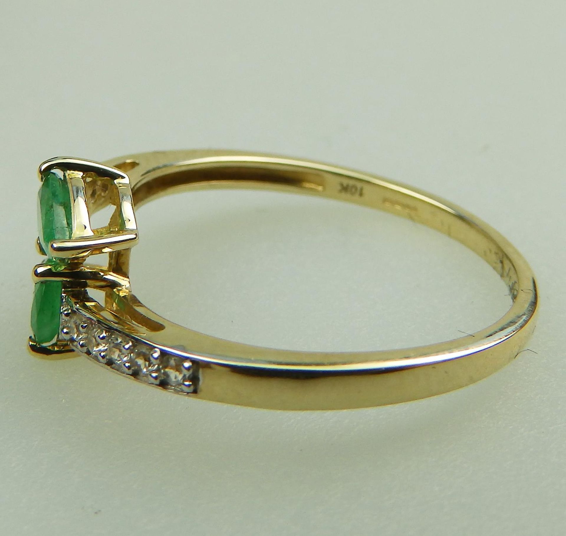 A 10ct gold, emerald and white topaz Crossover Ring, boxed - Image 5 of 5