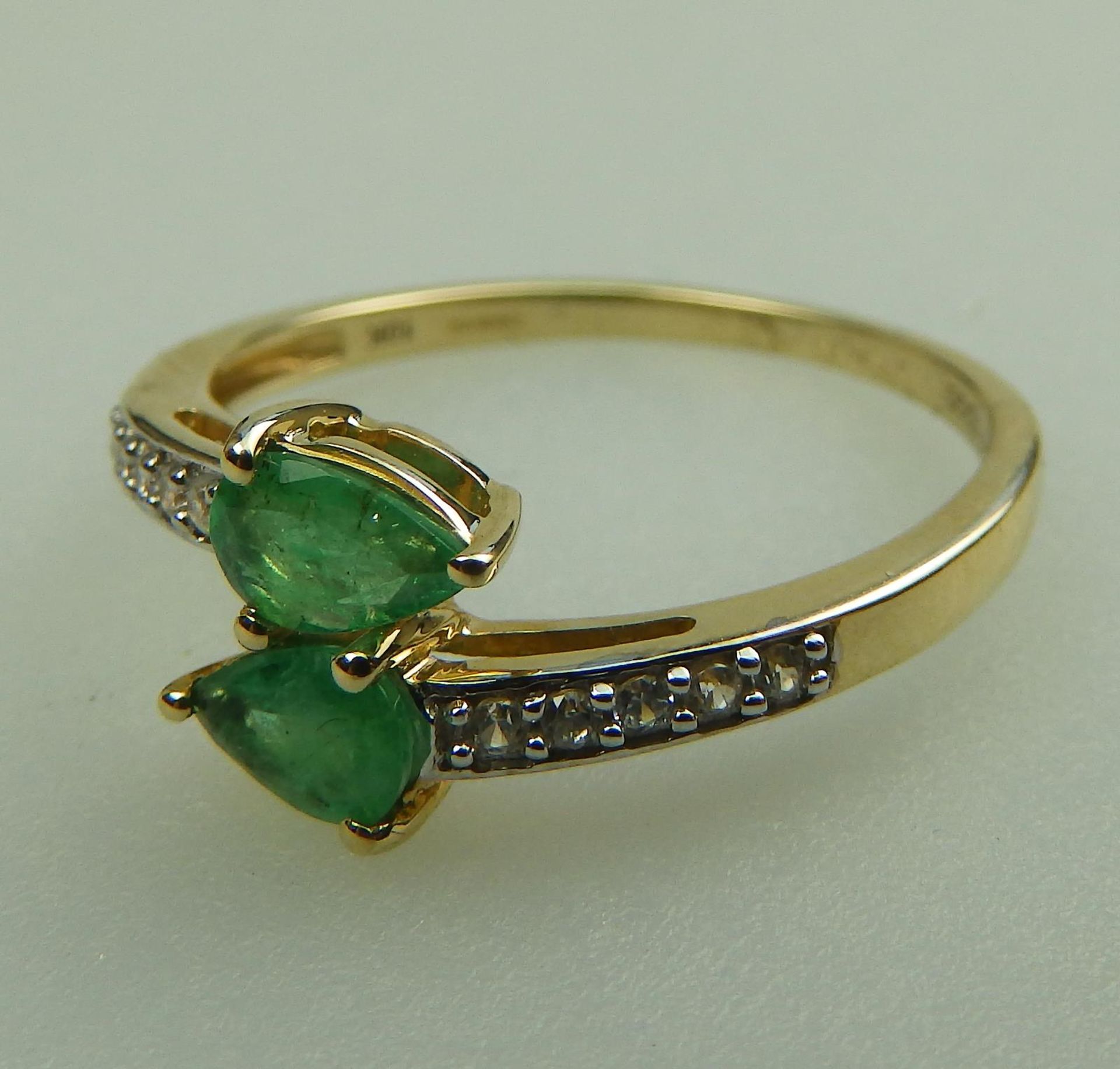 A 10ct gold, emerald and white topaz Crossover Ring, boxed - Image 4 of 5