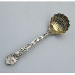An extremely fine cast solid silver Sifter Ladle by George Adams C.1863