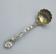 An extremely fine cast solid silver Sifter Ladle by George Adams C.1863