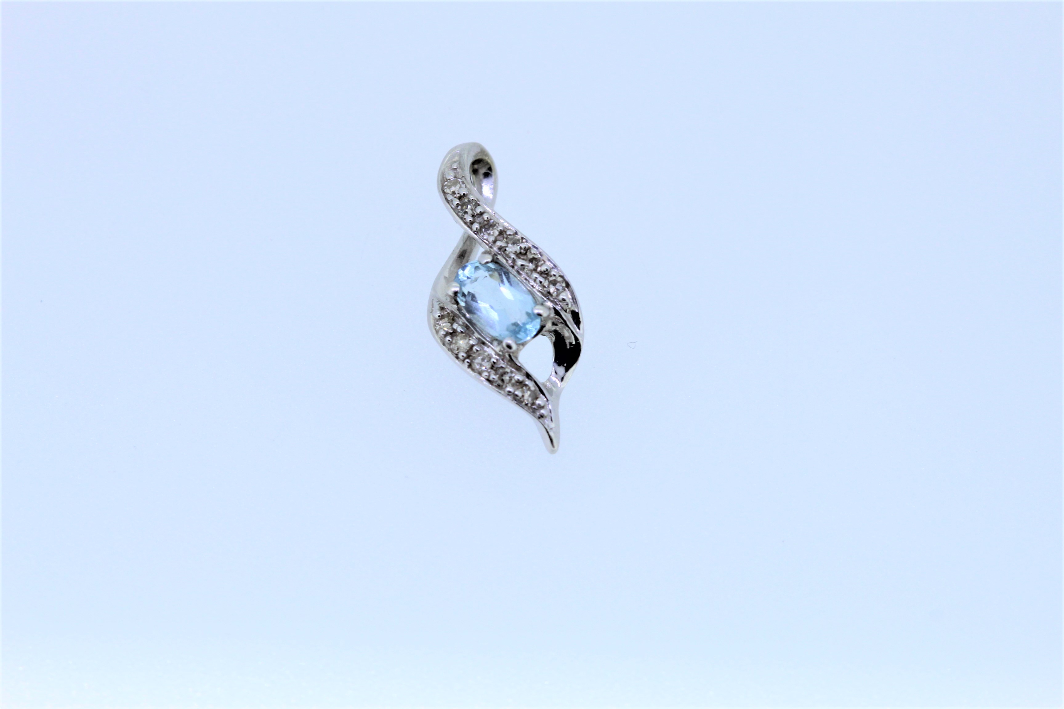 9k White Gold Topaz And Diamond Set Pendant