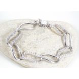 Silver bracelet with white stone