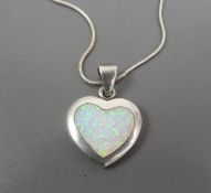 Silver necklace with heart shaped pendant with Opal