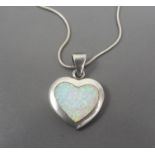 Silver necklace with heart shaped pendant with Opal