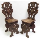 Pair of antique Italian walnut scabello chairs