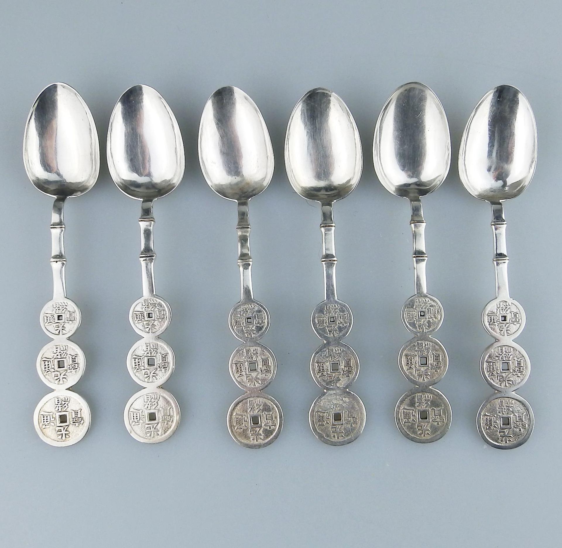 A set Chinese silver Shanghai Spoons by Lueng Wo C.19thC