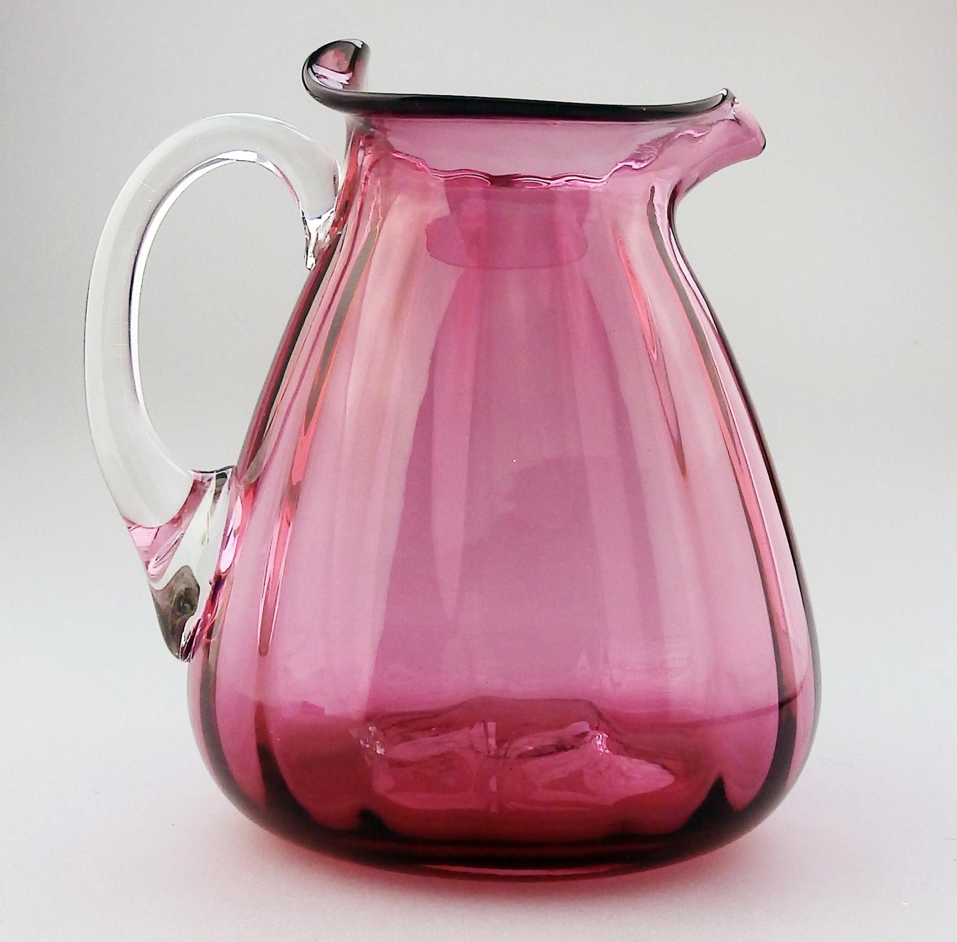 An unusual shape cranberry glass Victorian Jug C.19thC