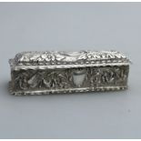 A pretty solid silver embossed Box with birds, flora, scrolls etc.. Birmingham 1898