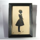 A large bronzed full portrait Silhouette picture of a Child C.19thC