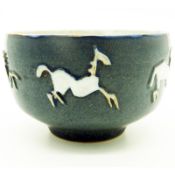 An Art Studio pottery Bowl with stylised galloping horses, signed C.20thC