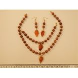 A Fossil Wood And Carnelian Arrow Heads Necklace, Bracelet And Earrings Set