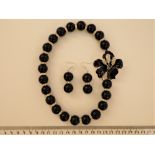 An Obsidian Necklace And Matching Earrings