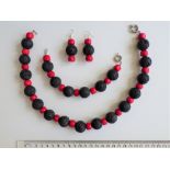 A Red Coral And Hawaiian Lava Necklace, Bracelet And Earrings Set.
