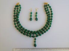 An Emerald Necklace With Matching Earrings