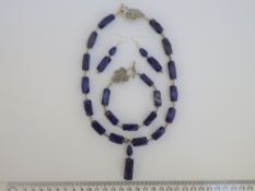 A Lapis Lazuli Necklace, Bracelet And Earrings Set