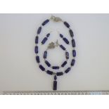 A Lapis Lazuli Necklace, Bracelet And Earrings Set