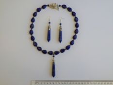 A Lapis Lazuli Necklace With Matching Earrings