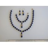 A Lapis Lazuli Necklace, Bracelet And Earrings Set