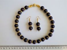 A Garnet Necklace And Earrings Set
