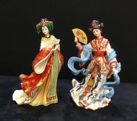 A pair of Danbury Mint fine porcelain oriental figures.