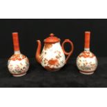 A pair of antique Japanese Kutani bottle vases and a similar Kutani design tea pot