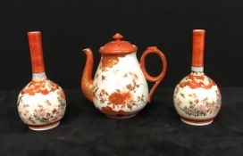 A pair of antique Japanese Kutani bottle vases and a similar Kutani design tea pot