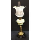 A Victorian 'duplex' oil lamp with handpainted glass reservoir