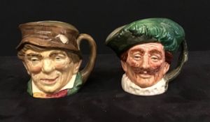 A pair of small Royal Doulton Toby Jugs