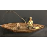 Retro fibreglass and resin fisherman in boat