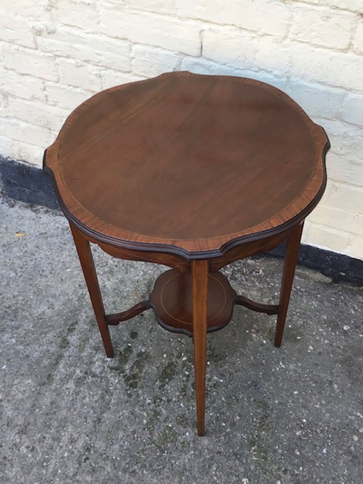 Antique mahogany inlaid occaisional table with raised under teir.