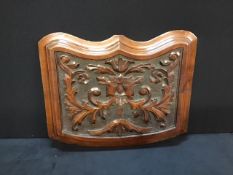 An antique Victorian carved mahogany panel.