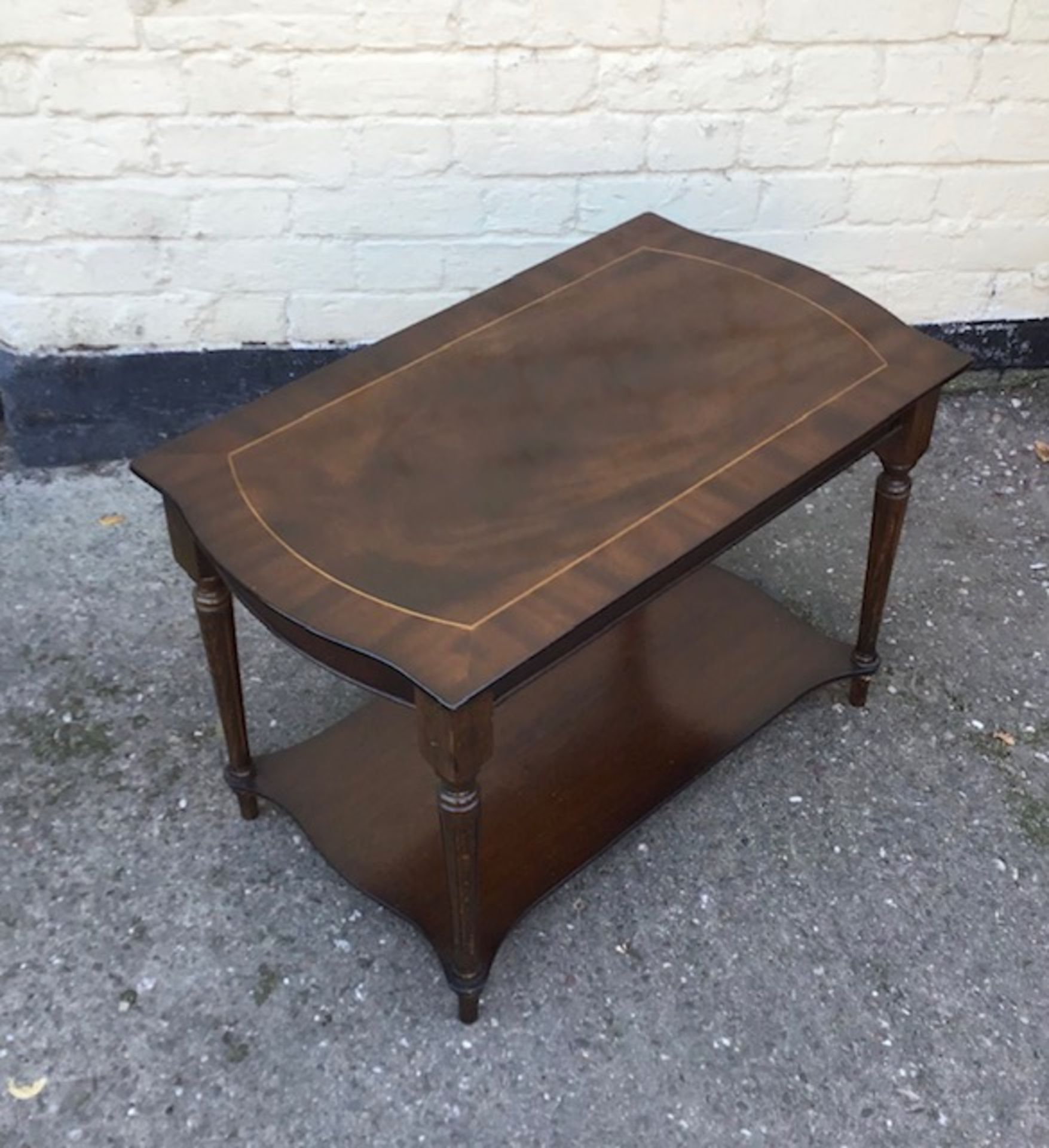 A 20th century coffee table wth under teir.