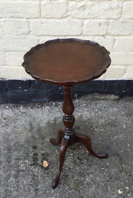 A 20th century small tripod wine table.