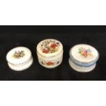 A group of three vintage ceramic lidded pots.