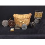 Assorted vintage fishing reels and wicker creel