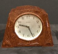 A vintage Art Deco Ingersol alarm clock with Bakelite case.