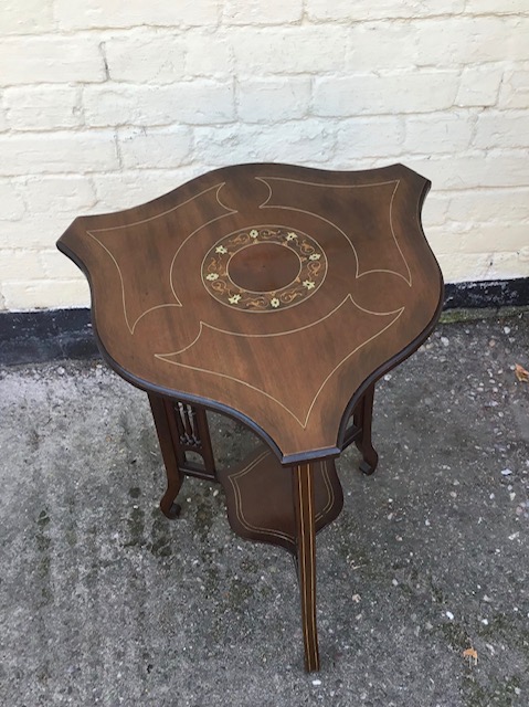 Antique inlaid mahogany Edwardian occaisional table with shaped top and fretwork supports.