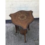 Antique inlaid mahogany Edwardian occaisional table with shaped top and fretwork supports.